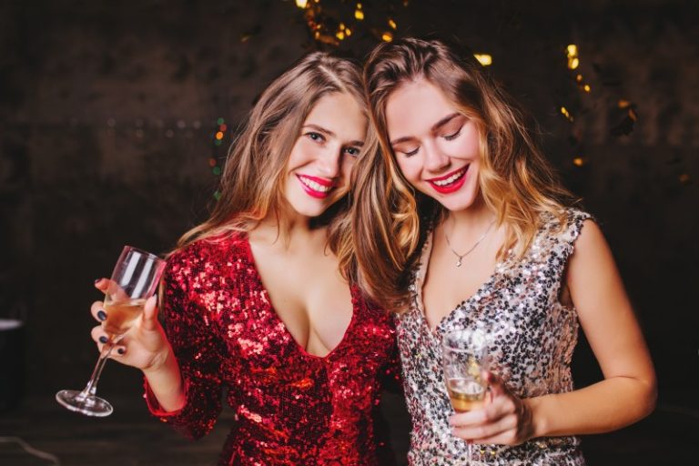 indoor-portrait-pleased-woman-trendy-sparkle-attire-enjoying-christmas-party-with-best-friend-1.jpg