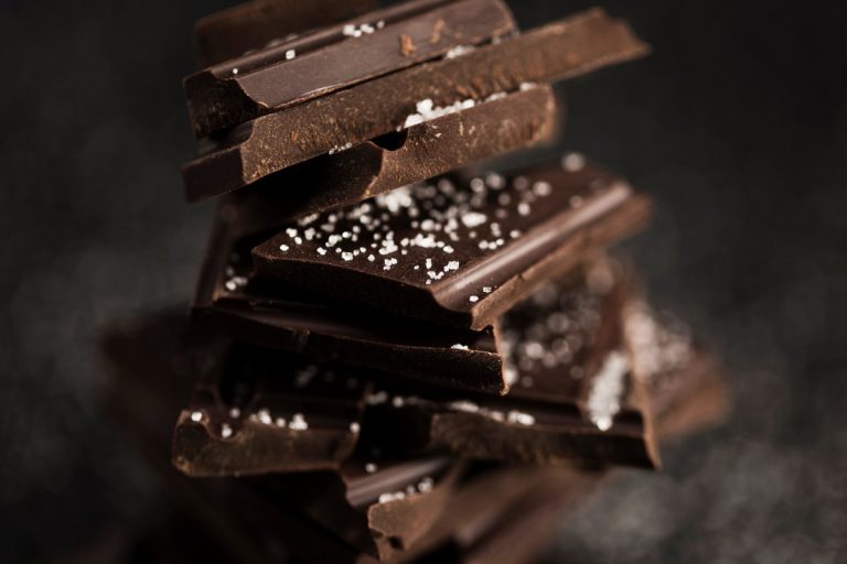 pieces-chocolate-blurred-background-1.jpg